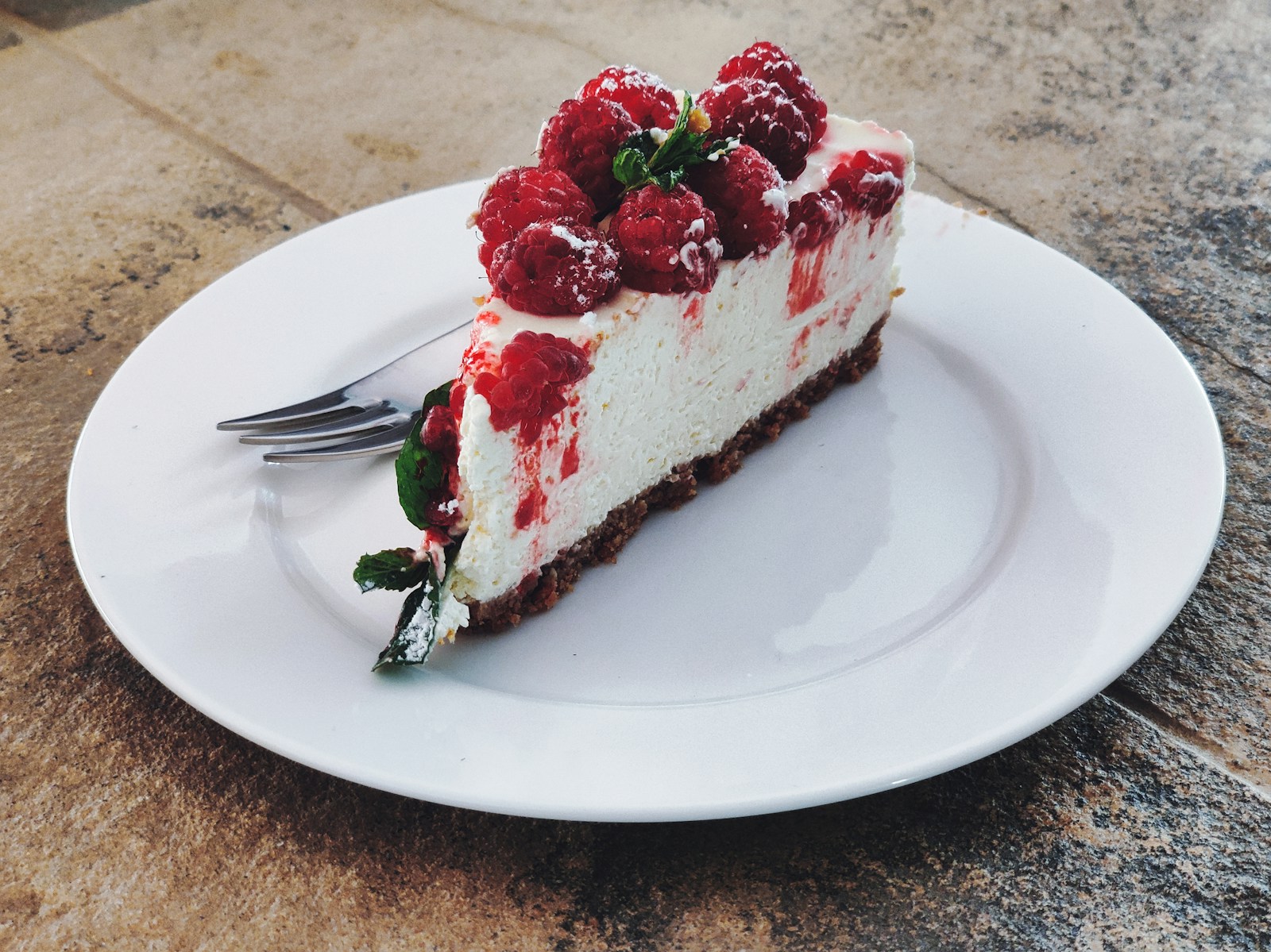 Photo by Kofi Okyere strawberry cake on white ceramic plate